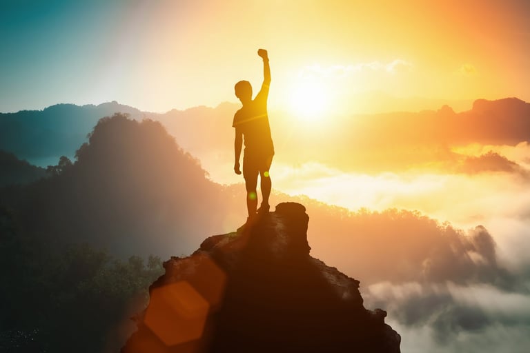 Silhouette of positive man celebrating on mountain top, with arms raised up, silhouette of man standing on the hill, Business, success, victory, leadership, achievement concept. Freedom travel adventure.