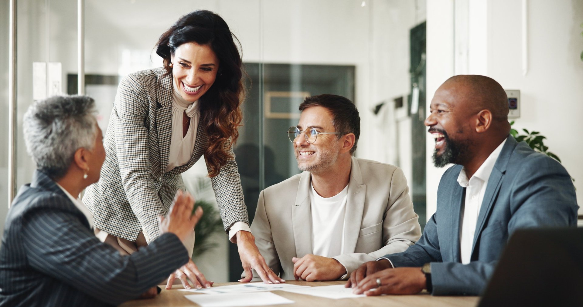 Meeting, documents and business people in office for finance investment with company with online. Collaboration, paperwork and financial management team with profit or revenue margin report.